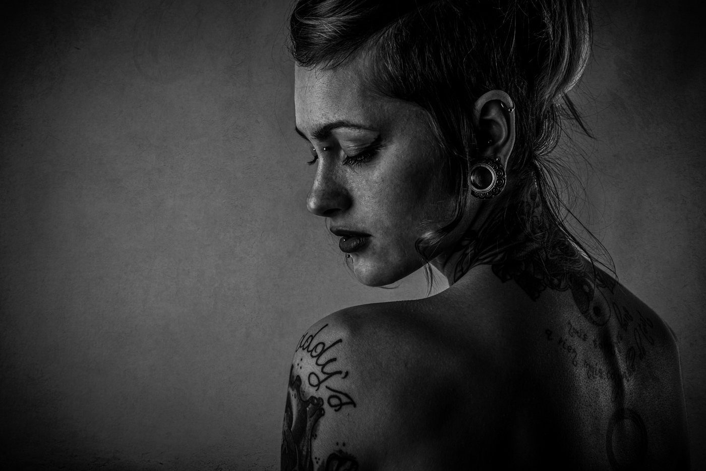 women with tattoo on left arm